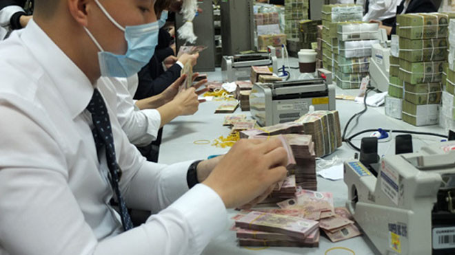 Bức tranh lợi nhuận ngân hàng 2013 vẫn chưa sáng sủa. Ảnh: Thanh Lan.