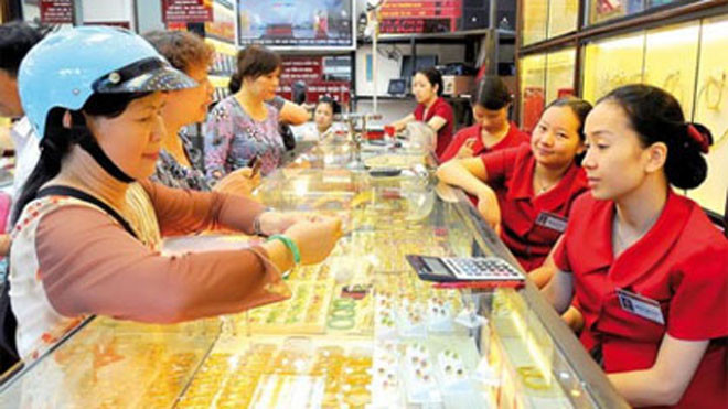 Vàng tăng, USD sắp chạm trần dù FED chưa tăng lãi suất