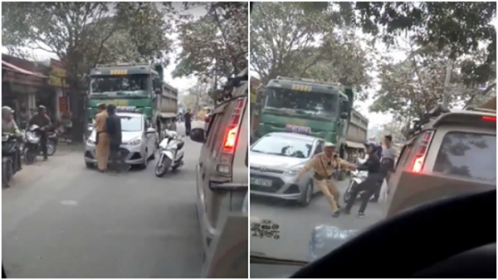 Hai đối tượng kéo, giằng co với CSGT để xe tải bỏ chạy.