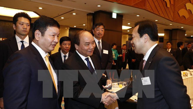 Thủ tướng Nguyễn Xuân Phúc trong buổi làm việc với các Doanh nghiệp Công nghệ thông tin Nhật Bản. (Ảnh: Thống Nhất/TTXVN)