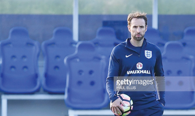 HLV Southgate dù không muốn vẫn phải ngồi lên chiếc ghế nóng ở tuyển Anh. Ảnh: GETTY IMAGES.