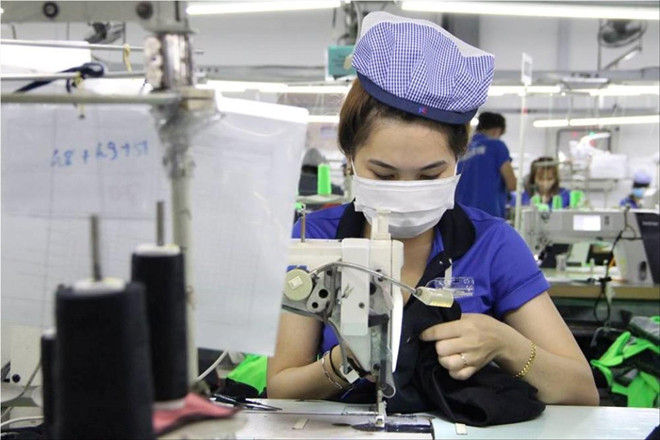 Công nhân ở Bình Dương trở lại làm việc ảnh: H.C