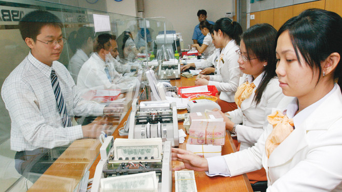 NHNN “đóng dấu” 2% biên độ tăng tỷ giá VND/USD cho năm 2015. Ảnh: Như Ý.