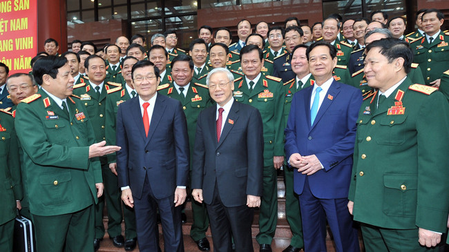 Tổng Bí thư Nguyễn Phú Trọng, Chủ tịch nước Trương Tấn Sang, Thủ tướng Nguyễn Tấn Dũng và các đại biểu trong ngày làm việc thứ hai của Đại hội (22/9). Ảnh: Trọng Đức - TTXVN.