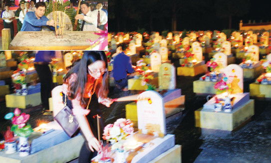 Thắp nến tri ân tại Nghĩa trang liệt sĩ Quốc gia Đường 9 tối 26/7 (ảnh lớn); Bí thư Thứ nhất Trung ương Đoàn Nguyễn Đắc Vinh và các đại biểu dâng hương tri ân các Anh hùng Liệt sĩ (ảnh nhỏ). Ảnh: Hữu Thành-Hồ Cầu.