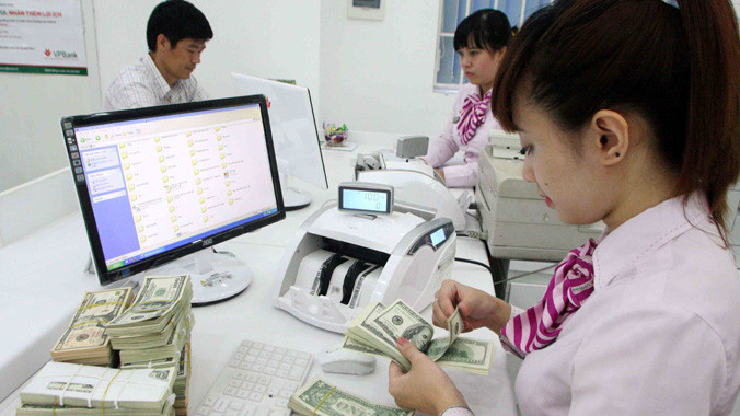 Lãi suất USD chỉ còn 0.25%/ năm đối với cá nhân gửi tiền. Ảnh: Trần Việt.