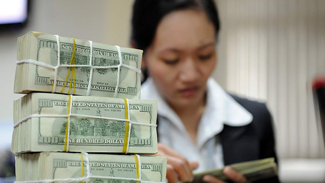 Ngân hàng Nhà nước cam kết sẽ không điều chỉnh tỷ giá. Ảnh: Hồng Vĩnh.