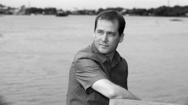 David Joiner bên dòng sông Sài Gòn năm 2014. Ảnh: Đoàn Đức Minh.