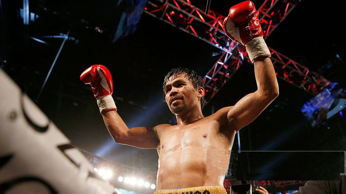Pacquiao ăn mừng chiến thắng cuối cùng trước khi treo găng. Ảnh: GETTY IMAGES