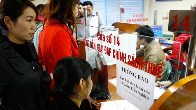 Chính phủ đặt mục tiêu nâng môi trường đầu tư, kinh doanh ngang bằng ASEAN 4. Ảnh: Hồng Vĩnh