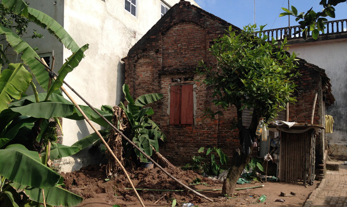 Khu vườn và nhà đối tượng H. là nơi phát hiện hai thi thể.