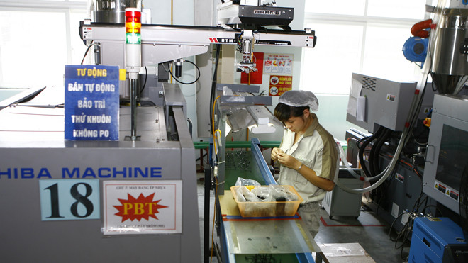 Nhiều DN tư nhân trong nước gặp khó khăn vì thể chế. Ảnh: Hồng Vĩnh