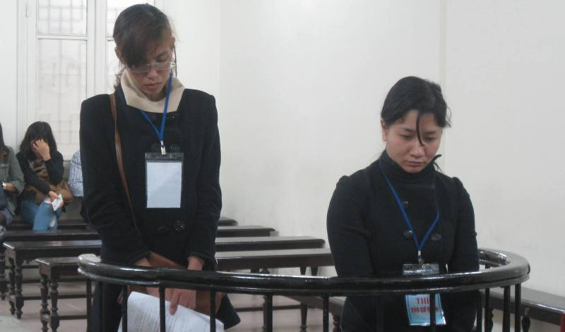 Hai bị cáo trong phiên xử ngày 4/3. Ảnh: BH