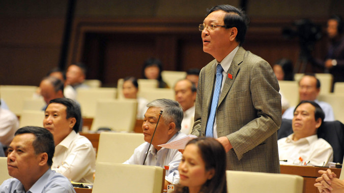 Bộ trưởng Phạm Vũ Luận khẳng định kỳ thi tốt nghiệp THPT 2015 đã làm giảm tốn kém tiền của, công sức của người dân. Ảnh: HL.