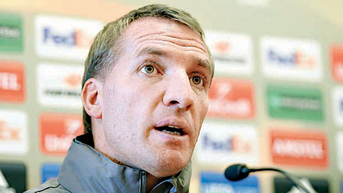 HLV Brendan Rodgers tự tin sẽ trụ vững ở Anfield dù những trận đấu gần đây Liverpool có kết quả không tốt. Ảnh: AP.