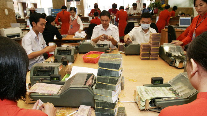 Giảm lãi suất như kỳ vọng của Chính phủ đang gặp khó. Ảnh: Như Ý.