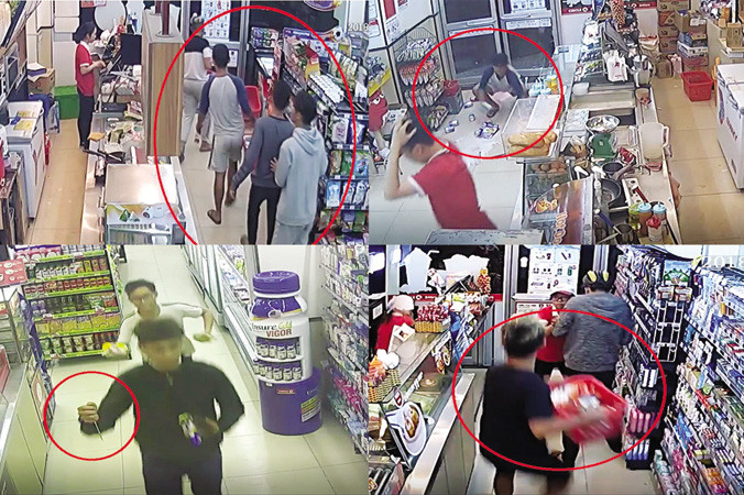 Các đối tượng giả khách hàng xông vào cửa hàng tiện ích 24 giờ cướp tài sản. Ảnh cắt từ clip.