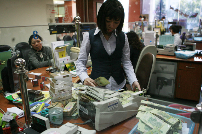 Dự kiến mức điều chuyển tiền mặt trong dịp tết năm nay tăng 20% đáp ứng nhu cầu nền kinh tế. Ảnh: Hồng Vĩnh.