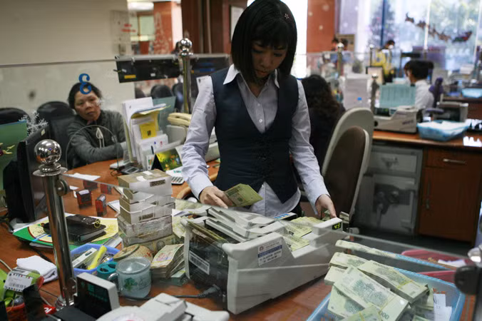Dự kiến mức điều chuyển tiền mặt trong dịp tết năm nay tăng 20% đáp ứng nhu cầu nền kinh tế. Ảnh: Hồng Vĩnh.