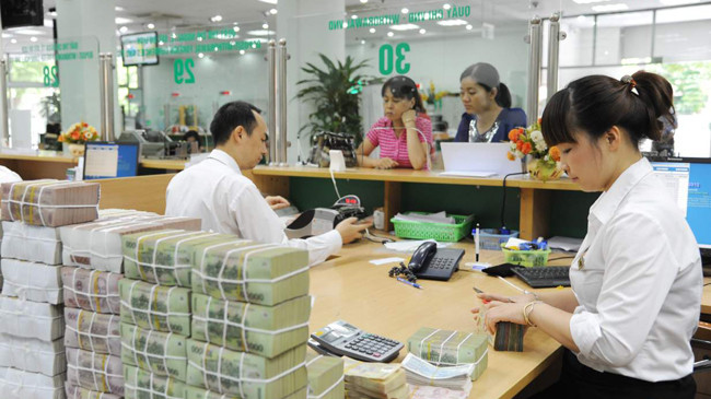 Khi làm dự án doanh nghiệp phải vay tiền ngân hàng, nhưng khi quyết toán xong vẫn không được thanh toán, trong khi doanh nghiệp vẫn phải trả lãi ngân hàng. Ảnh: Hồng Vĩnh