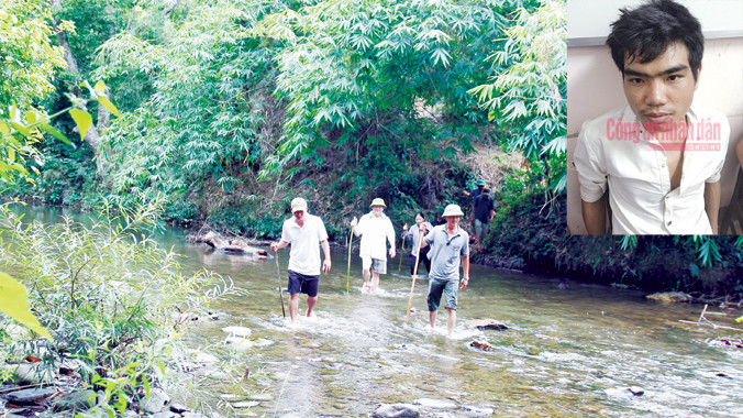 Đại tá Nguyễn Hữu Cầu - Giám đốc công an tỉnh Nghệ An (giữa) cùng các trinh sát trèo đèo, lội suối truy tìm thủ phạm, phá án. Ảnh: Cảnh Huệ