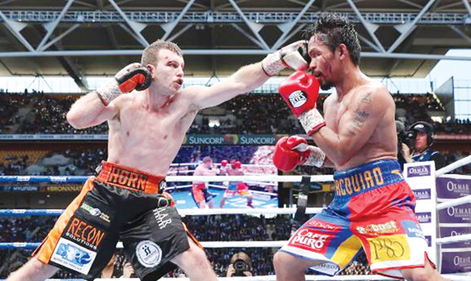 Horn (trái) đánh bại Pacquiao trong trận tranh đai vô địch WBO đầy tranh cãi. Ảnh: GETTY IMAGES.