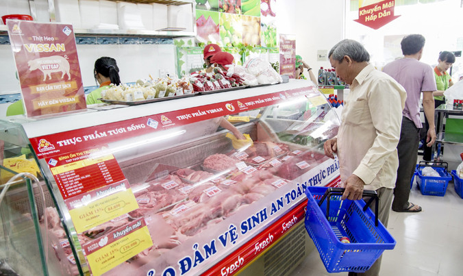 Bộ trưởng Nguyễn Xuân Cường kêu gọi DN xúm tay hỗ trợ nông dân lúc khó khăn nhất. Ảnh: Bình Phương.