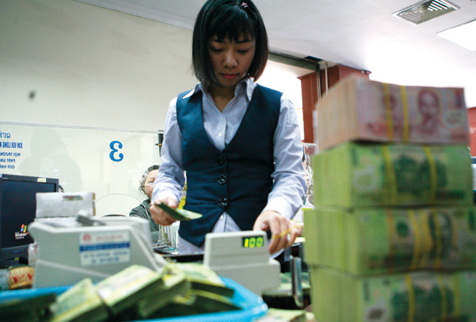 Cung tiền mạnh ra lưu thông sẽ tạo áp lực lên lạm phát, tỷ giá. Ảnh: Hồng Vĩnh.