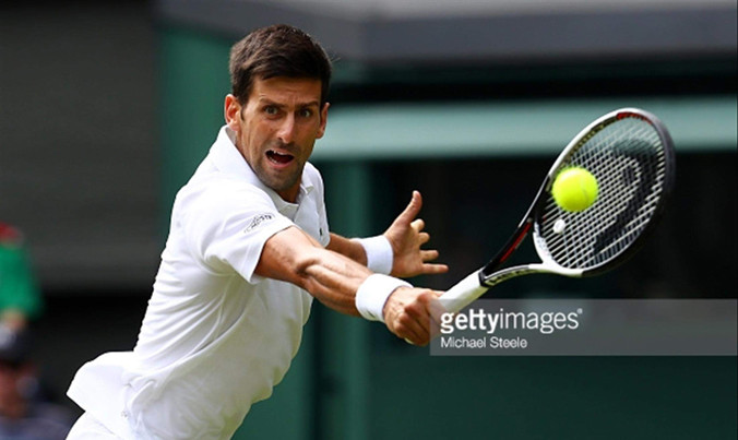 Djokovic không tốn nhiều công sức cũng tiến vào vòng 2 do đối thủ dù chấn thương vẫn cố ra sân để lấy tiền thưởng. Ảnh: GETTY IMAGES.