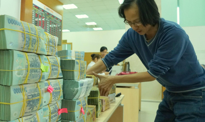 Giới ngân hàng vẫn đang gian nan xử lý nợ xấu.