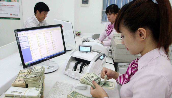 Theo NHNN, tỷ giá những ngày qua biến động do tâm lý và cầu tỷ giá đang bị thổi phồng. Ảnh: Trần Việt