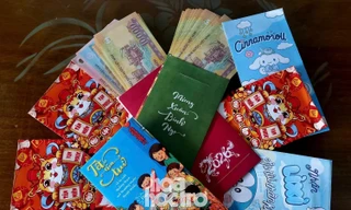 Giới trẻ có chung hành động khi được mừng tuổi: Dùng bao lì xì làm "ví vía"