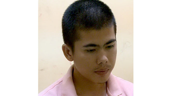 Đối tượng Huỳnh Thanh Khải tại cơ quan công an. Ảnh: Thành Phong