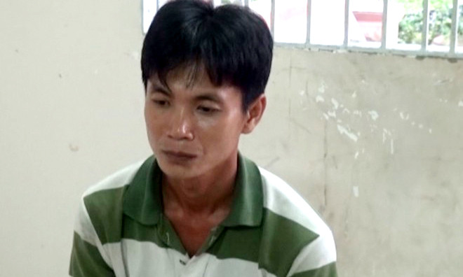 Lê Trọng Nghĩa tại cơ quan công an. Ảnh: Minh Anh