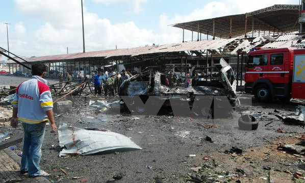 Hiện trường vụ nổ bom ở thành phố Jableh, Syria ngày 23/5. Nguồn: AFP/TTXVN.