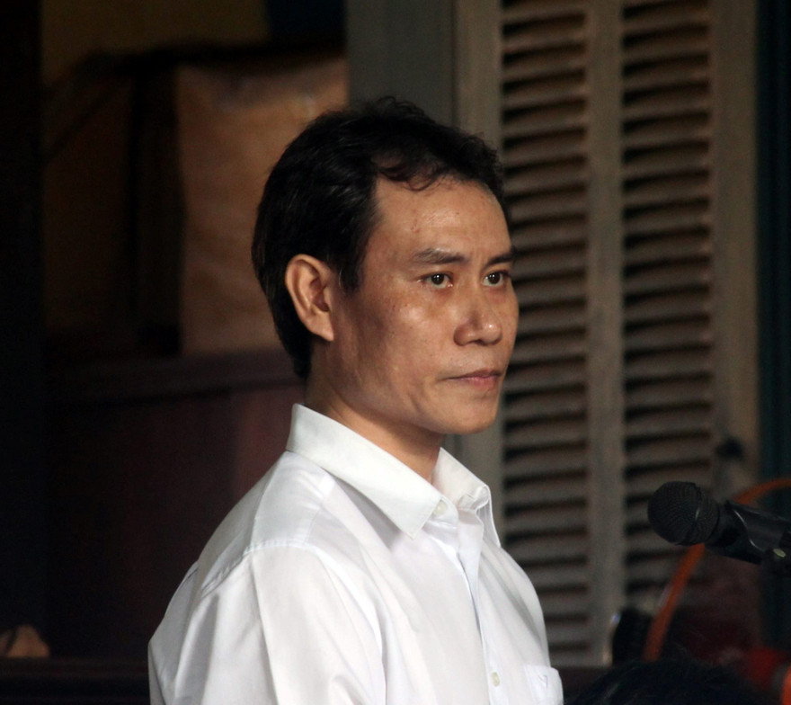 Nguyên thiếu úy công an – bị cáo Lê Hoàng Quân tại phiên tòa sáng 13/7. Ảnh: Tân Châu