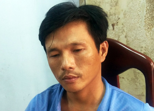 Kẻ giết người bị cảnh sát bắt giữ. Ảnh: Xuân Ngọc