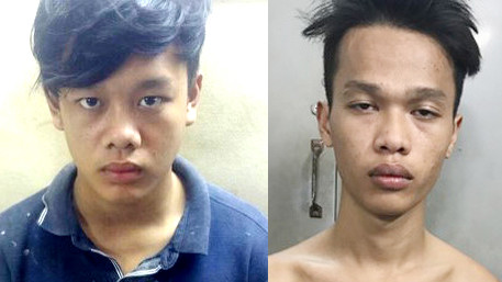 Hai nghi can giết người Giang (trái) và Trí tại cơ quan điều tra. Ảnh: Công an cung cấp.
