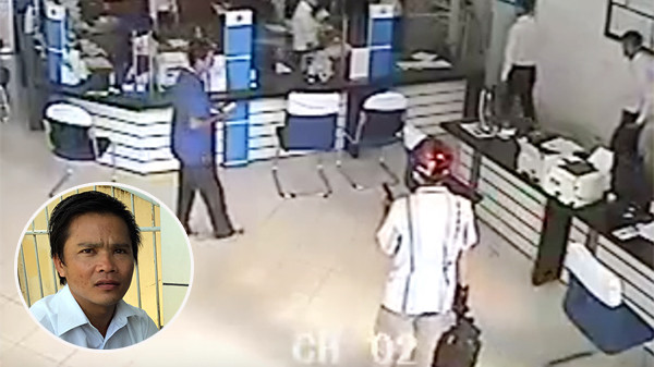 Tên cướp cầm súng khống chế mọi người trong ngân hàng và gí súng vào đầu bảo vệ