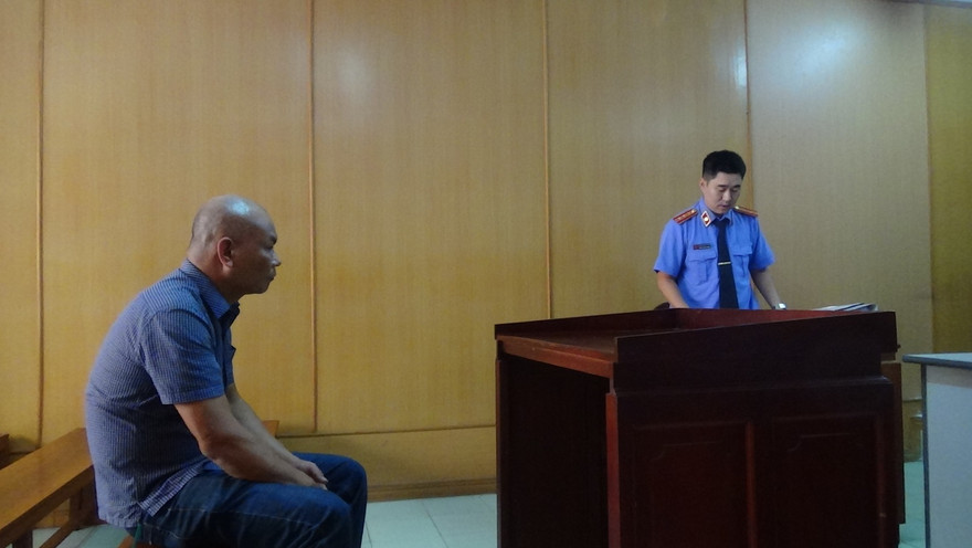 Trần Văn Miên tại tòa. Ảnh: Tân Châu.