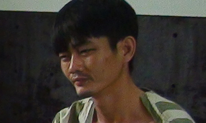 Minh tại cơ quan điều tra. Ảnh CAND. 