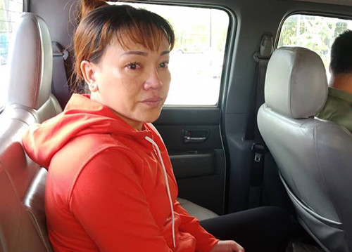 Loan bị cảnh sát đưa về trụ sở. Ảnh: Công an cung cấp