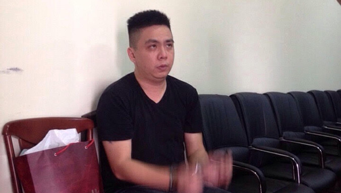 Nghi can cầm đầu Wong Boon Leong tại cơ quan điều tra. Ảnh T.Chung.