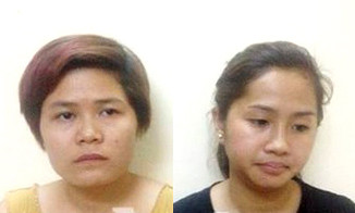 Hoàng Thị Anh (áo vàng) và Vũ Thị Vân Anh (áo đen)