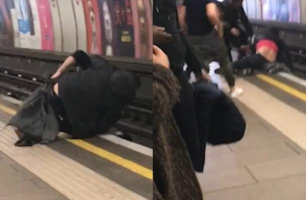 Hai người đàn ông say xỉn ngã xuống đường tàu.