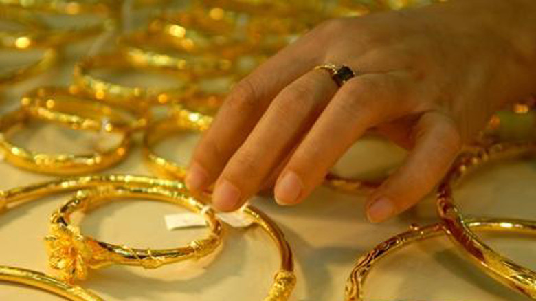 Giá vàng tăng nhẹ, USD giảm