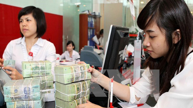 Bình quân thưởng Tết Ất Mùi 2015 là 5 triệu đồng, tăng 15% so với năm 2014. Ảnh minh họa: TTXVN.