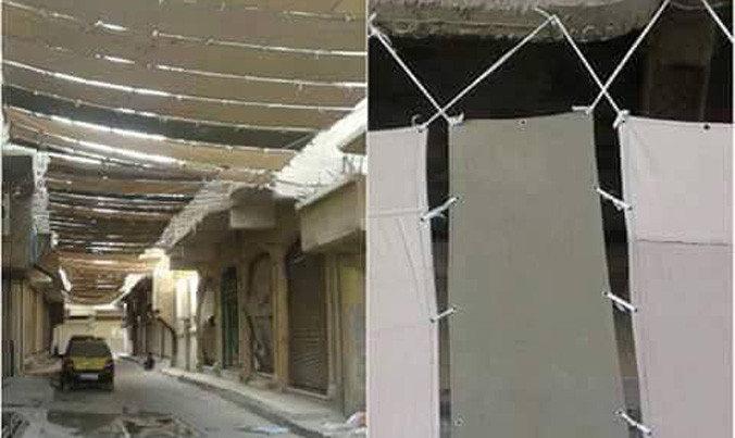 Bạt được che phủ khắp các tuyến đường ở Raqqa. Ảnh: Telegraph.