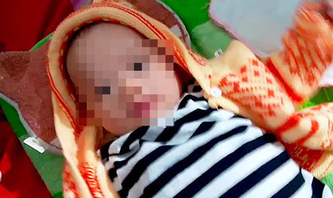 Bé trai được xác định khoảng 3 tháng tuổi, sức khỏe tốt. Ảnh: Đ.H.