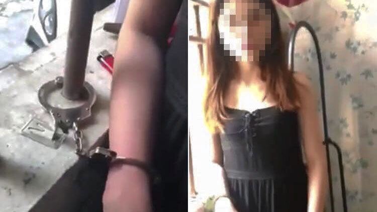Hình ảnh cô gái bị còng tay vào song cửa sổ phòng trọ. Ảnh: Cắt từ video